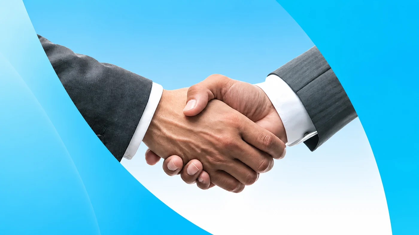 Two people shaking hands on a new project